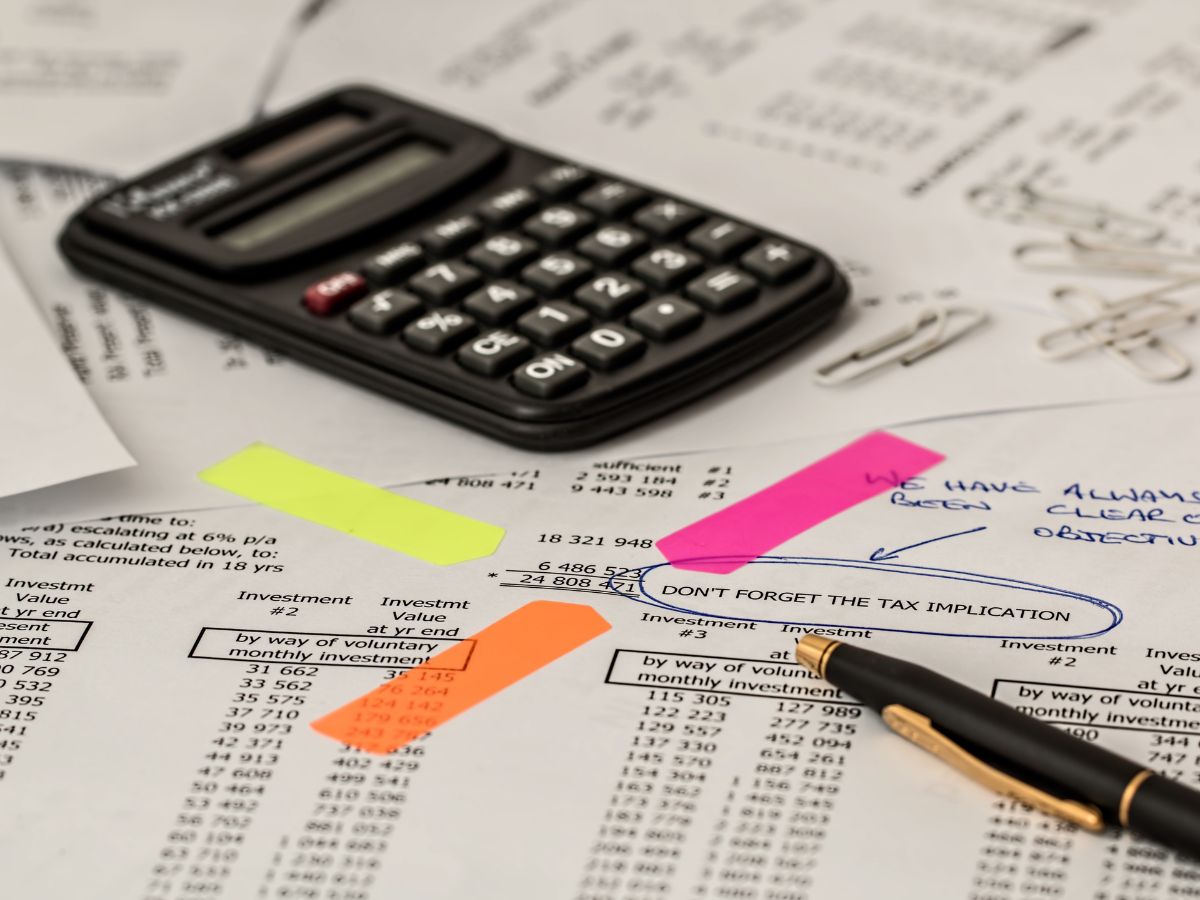 Accountant reviewing financial records and calculations to ensure accuracy and compliance