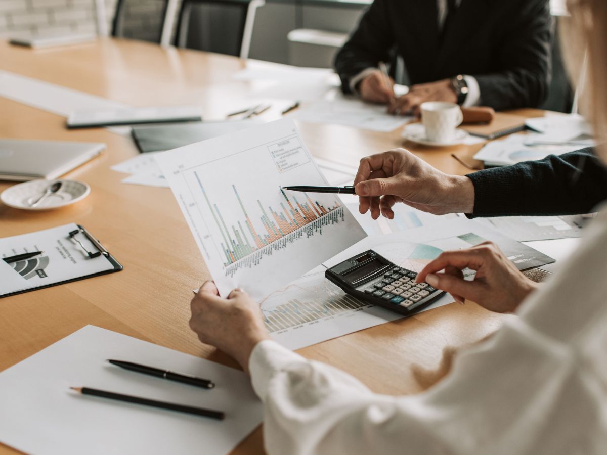 Accountant reviewing financial reports and providing personalized accounting guidance to a client