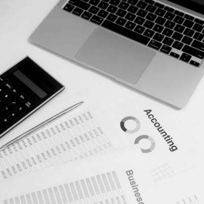 Accounting reports, financial statements, and laptop representing professional accounting and advisory services
